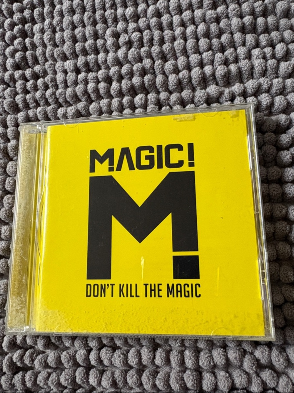Magic Yellow Cover CD with Bold Black Lettering